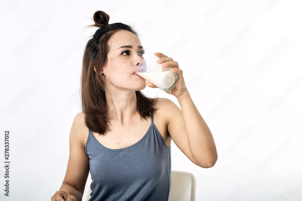 young woman drinking milk on table young woman drinking milk on table