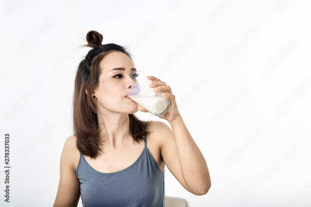 young woman drinking milk on table young woman drinking milk on table