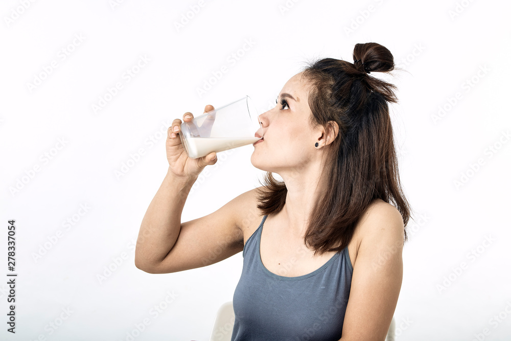 young woman drinking milk on table young woman drinking milk on table
