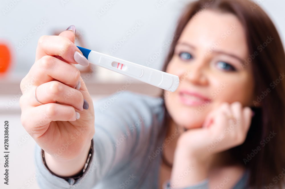 Young woman finding out about her pregnancy Young woman finding out about her pregnancy