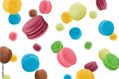 Falling macaroons isolated on white background, selective focus