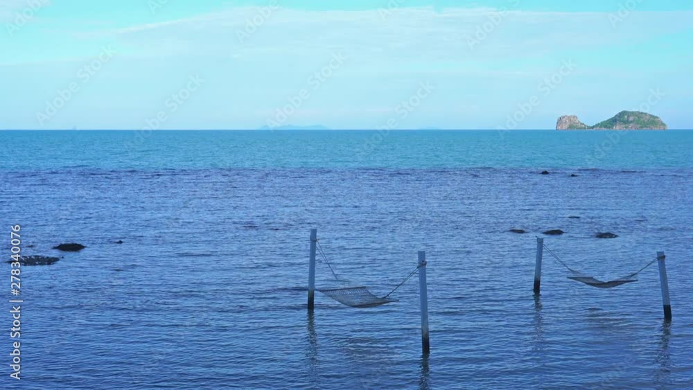Static shots of an infinity pool with small islands scattered in the sea in the background Static shots of an infinity pool with small islands scattered in the sea in the background