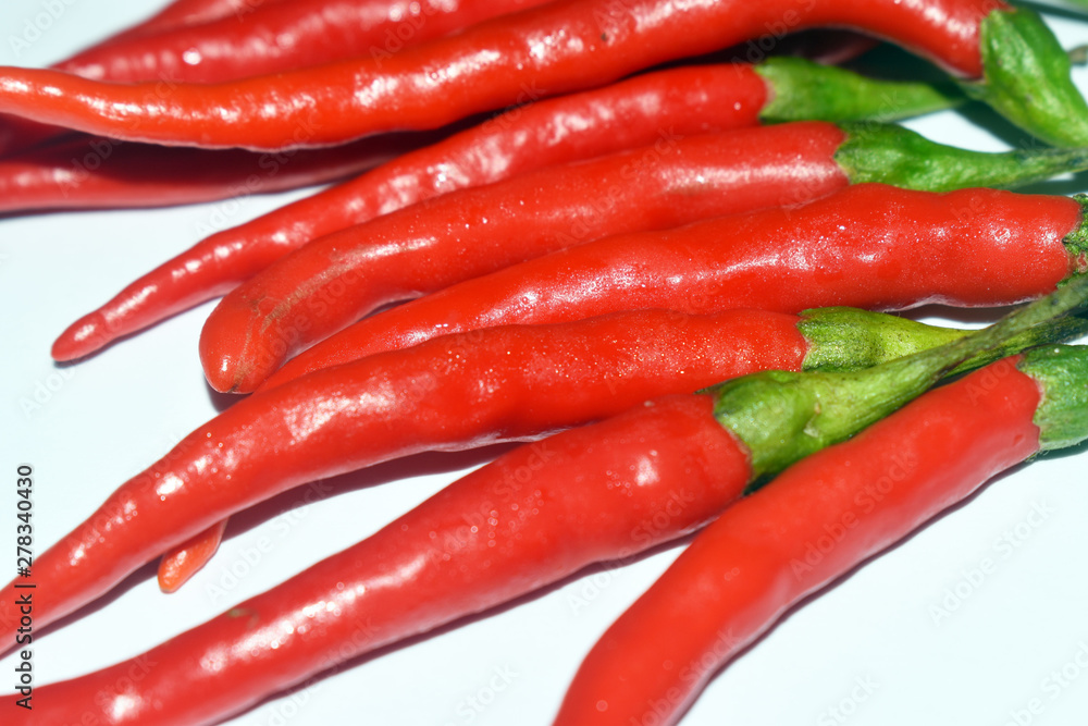 close up fresh red chilies, spicy isolated white background