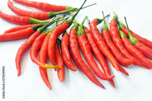 close up fresh red chilies, spicy isolated white background