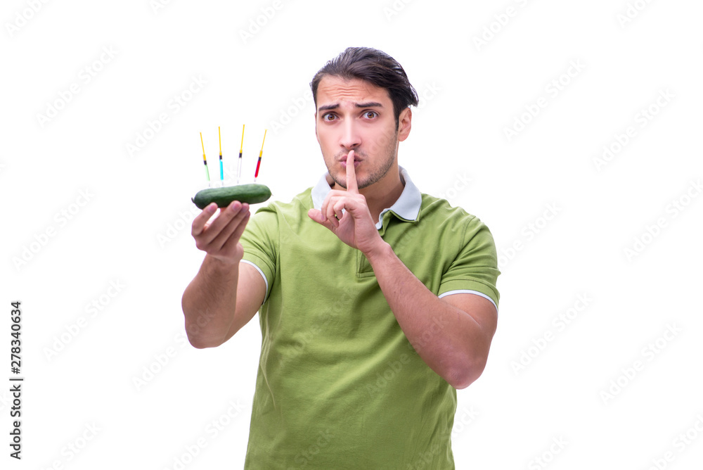 Young man in GMO fruits and vegetables concept Young man in GMO fruits and vegetables concept