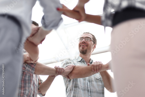 bottom view. creative business team standing in a circle