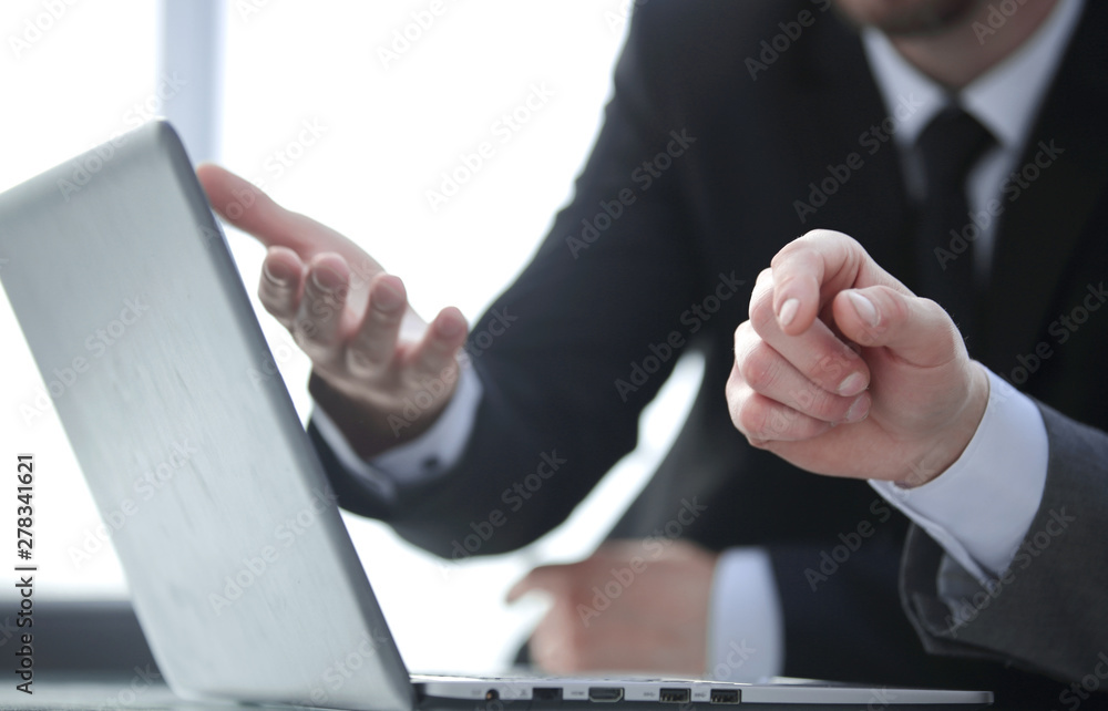close up. two business people analyzing online information close up. two business people analyzing online information
