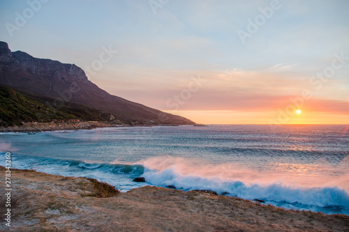 Chapman's Peak Drive Through the Mountains in Cape Town at Sunset Next to the Sea with Crashing Waves in South Africa