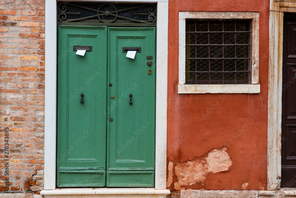 Old beautiful door in the Venetian style
