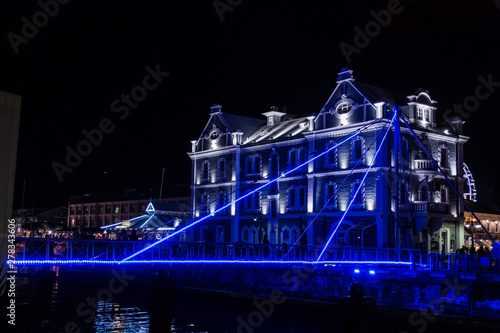 Old Victorian Style Architecture Building At Night Lit Up With Lights at The V&A Waterfront in Cape Town, South Africa