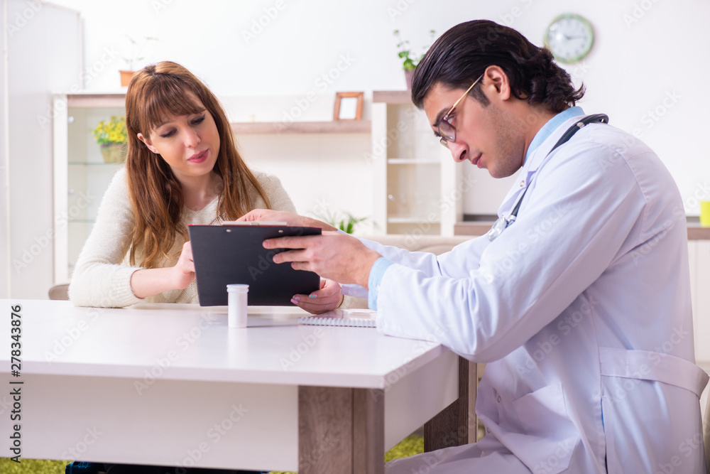 Young female patient discussing with male psychologist personal Young female patient discussing with male psychologist personal