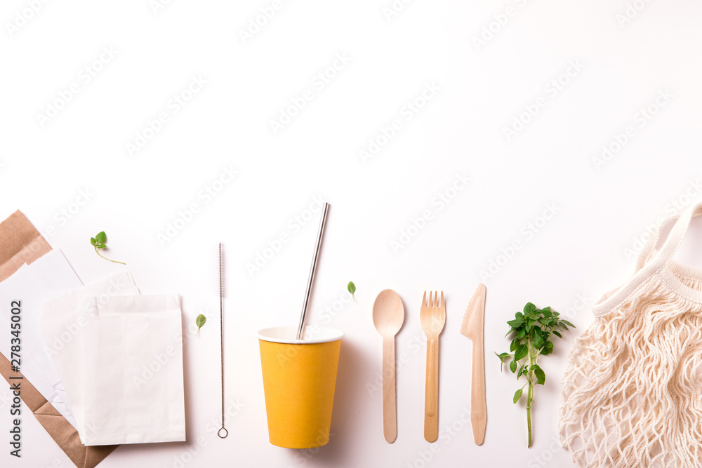 Top view of set of Eco-friendly bamboo cutlery, eco bag, water bottle. Sustainable lifestyle. Flat lay. Plastic free concept.