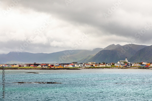 Andenes village panorama with multiple houses and mountains in the background, Lofoten islands, Andoy Municipality, Vesteralen district, Nordland county, Norway