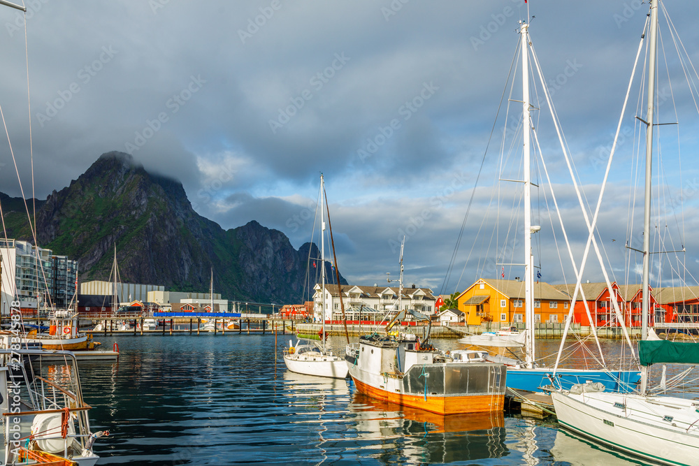 Yachts and boats with mountain in the background at pier in Svolvaer, Lototen islands, Austvagoya, Vagan Municipality, Nordland County, Norway