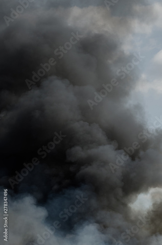 Black smoke fire clouds background