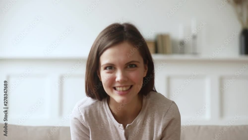 Happy young woman youtuber laughing recording vlog looking at camera Happy young woman youtuber laughing recording vlog looking at camera