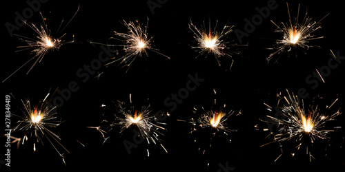 Set of sparklers on black background photo