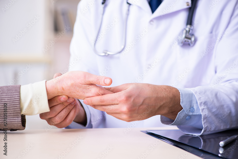 Young doctor examining senior old woman Young doctor examining senior old woman