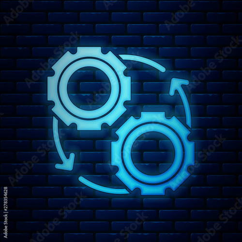 Glowing neon Gear and arrows as workflow process concept icon isolated on brick wall background. Gear reload sign. Vector Illustration