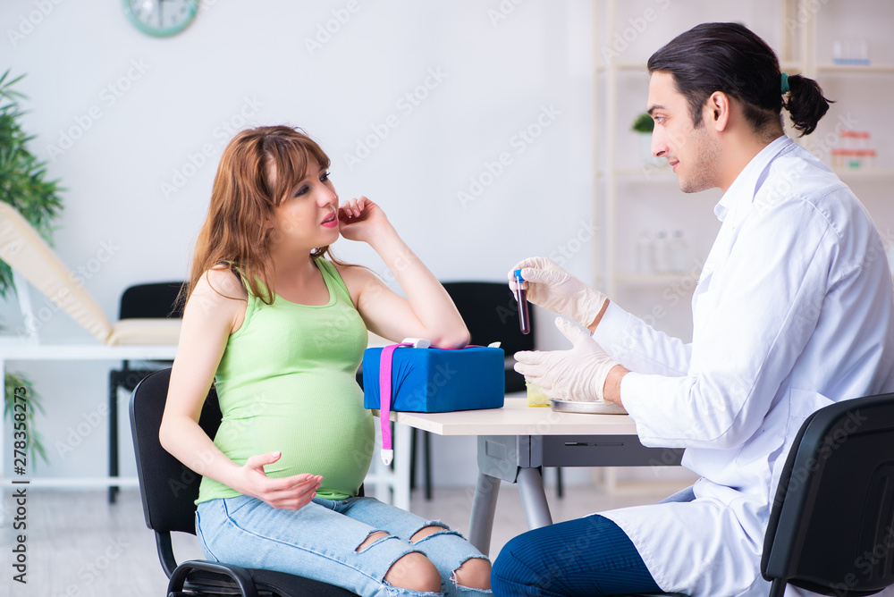 Obraz premium Young pregnant woman in blood transfusion concept