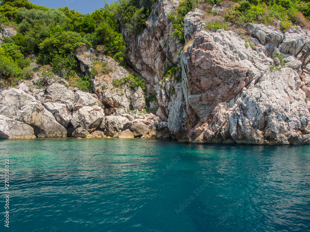 Fototapeta premium Rocky shores and blue Adriatic sea near the town of Budva, Montenegro