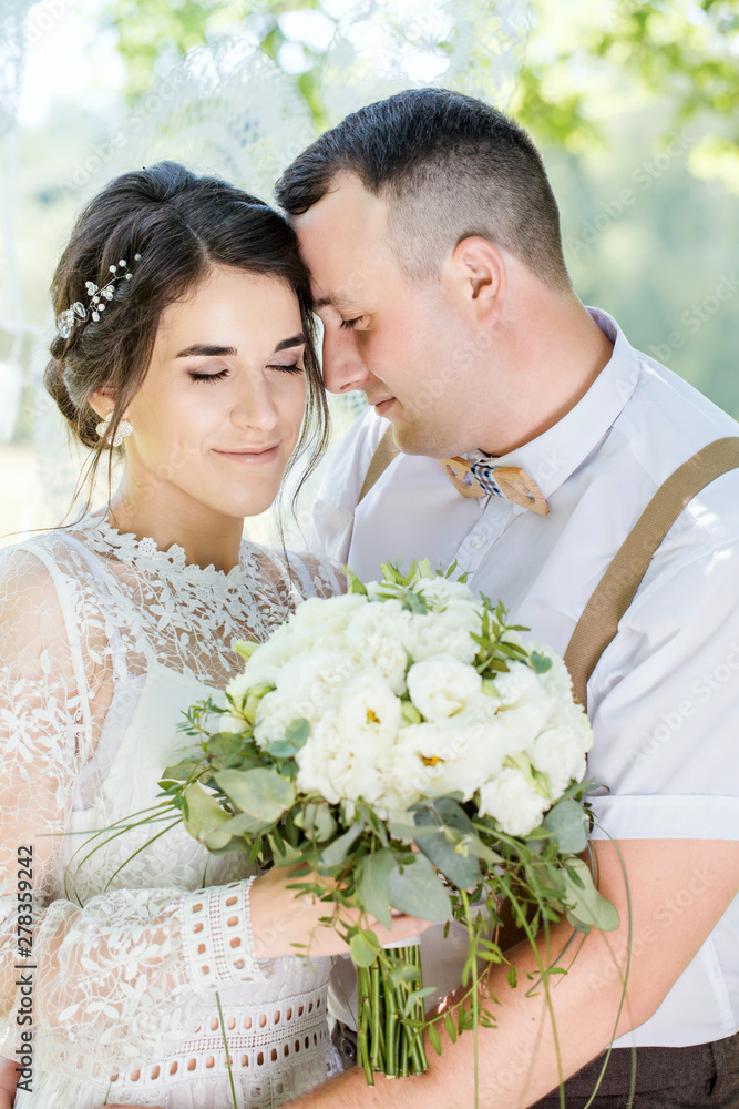 portrait of a young newlywed couple portrait of a young newlywed couple