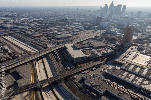 Aerial view of streets, buildings, smog and the Los Angeles river near downtown LA in Southern California.