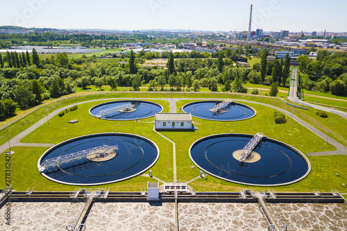 Aerial view of sewage treatment plant. Industrial water treatment for big city from drone view. Waste water management.