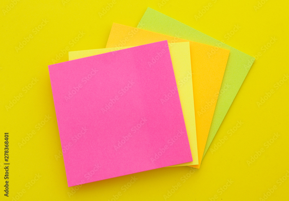 Colorful paper stickers on yellow background, blank note papers with copyspace. Colorful paper stickers on yellow background, blank note papers with copyspace.