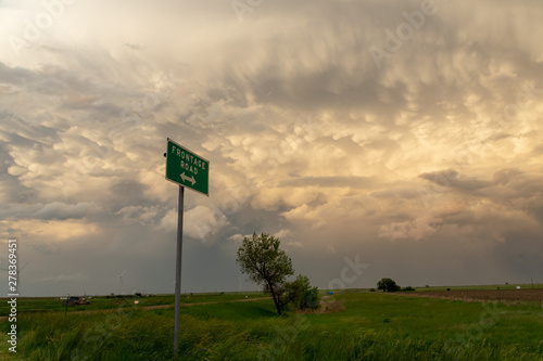 Road sign and mammatus clouds in Colorado, USA