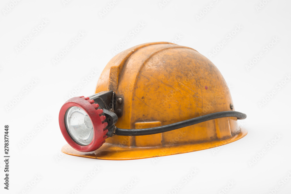Old miner helmet with lamp on white background. Stock Photo | Adobe Stock
