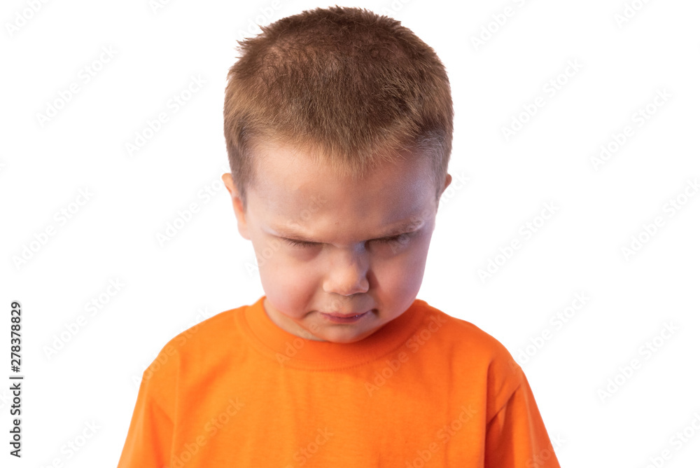 The little boy frowned angrily face and looking down, isolated on white background The little boy frowned angrily face and looking down, isolated on white background