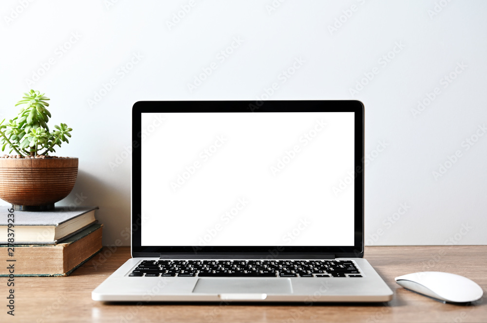 Laptop computer with blank screen in office Laptop computer with blank screen in office