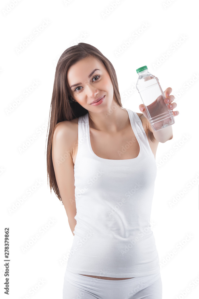 Young healthy woman drinking clean water. Female holding a bottle of water on isolated white background. Young healthy woman drinking clean water. Female holding a bottle of water on isolated white background.