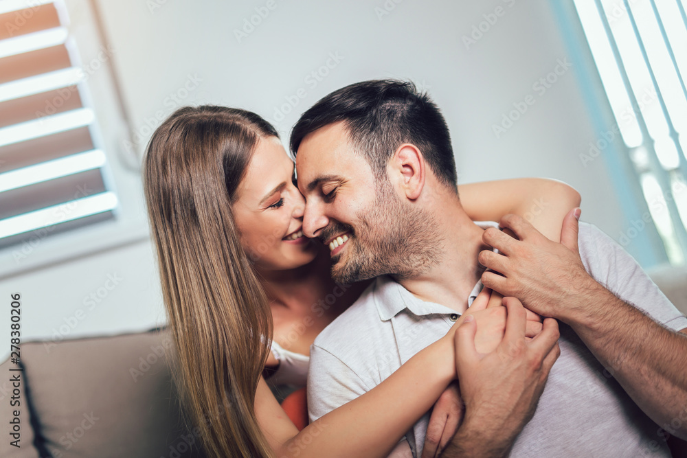 Fototapeta premium Beautiful couple hugging and looking at each other