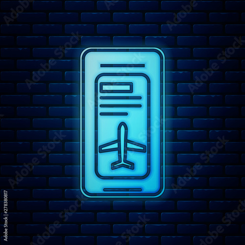 Glowing neon Smartphone with electronic boarding pass airline ticket icon isolated on brick wall background. Passenger plane mobile ticket for web and app. Vector Illustration