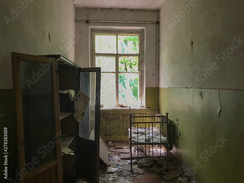 Crumbling ruins of a school in Pripyat, Ukraine near Chernobyl that was abandoned after the nuclear accident in the 1980s photo