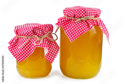 Jars of honey isolated on white background