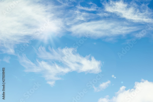 Blue sky with clouds background. Beautiful white fluffy clouds on a light blue sky background. Clearing day and Good weather in the morning.