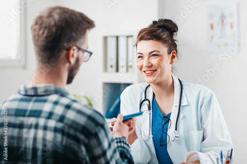Photography Woman Doctor prescribes medicine to Young Patient