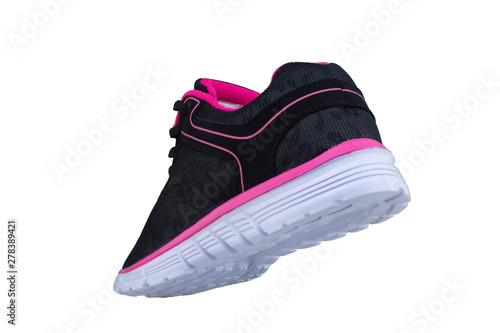 Black sneakers with pink accents on a white sole. Sport shoes on a white background.
