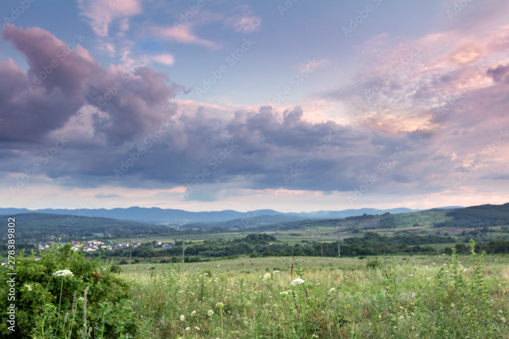 landscape bright colorful clouds in the light of the sunset landscape bright colorful clouds in the light of the sunset