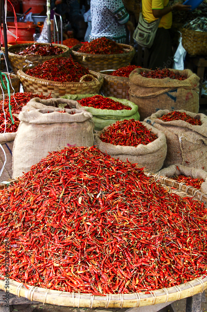 Fototapeta premium Close-up of packs full of chili pods on a traditional market in Myanmar/Birma.