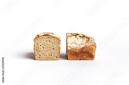 Fresh home-made bread with a crispy crust, on white background.