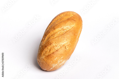 Fresh home-made bread with a crispy crust, on white background.
