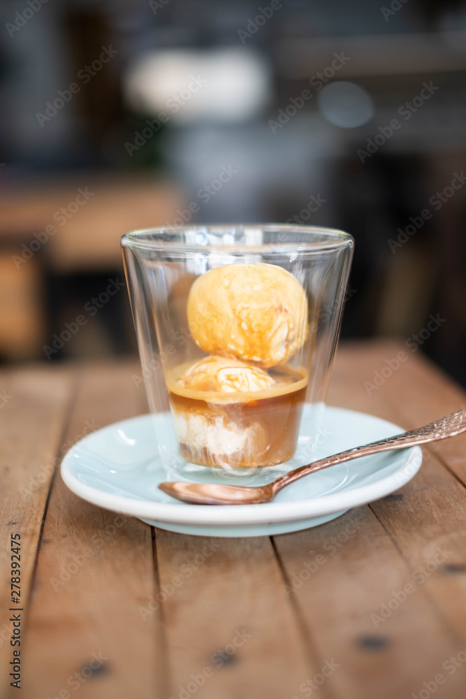 Affogato coffee with ice cream on wooden table. Affogato coffee with ice cream on wooden table.