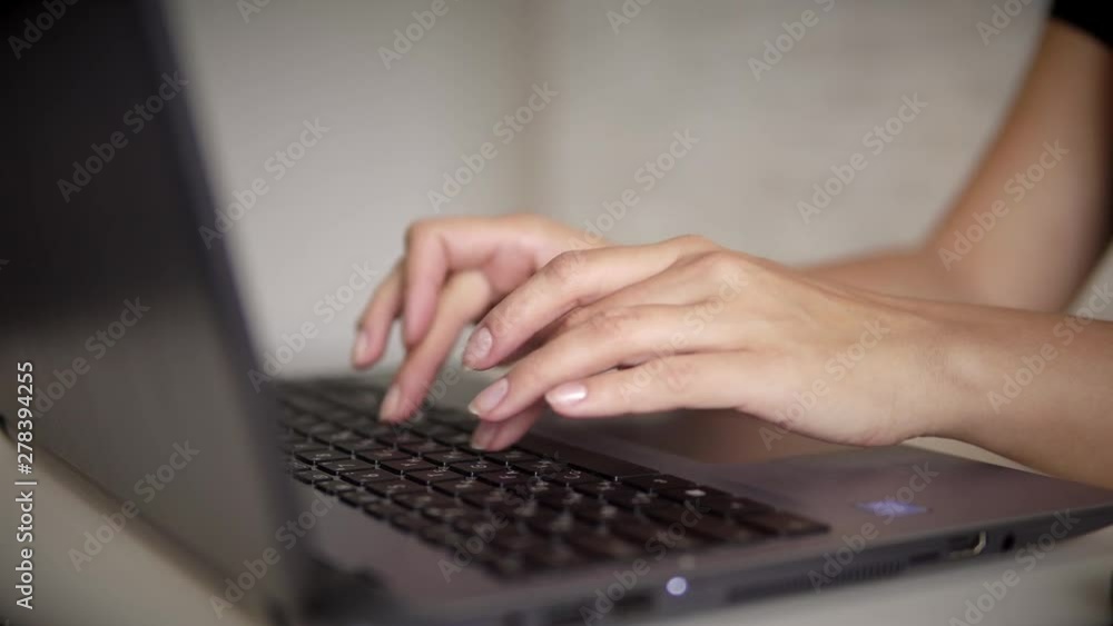 Young girl typing on a laptop. Young girl typing on a laptop.