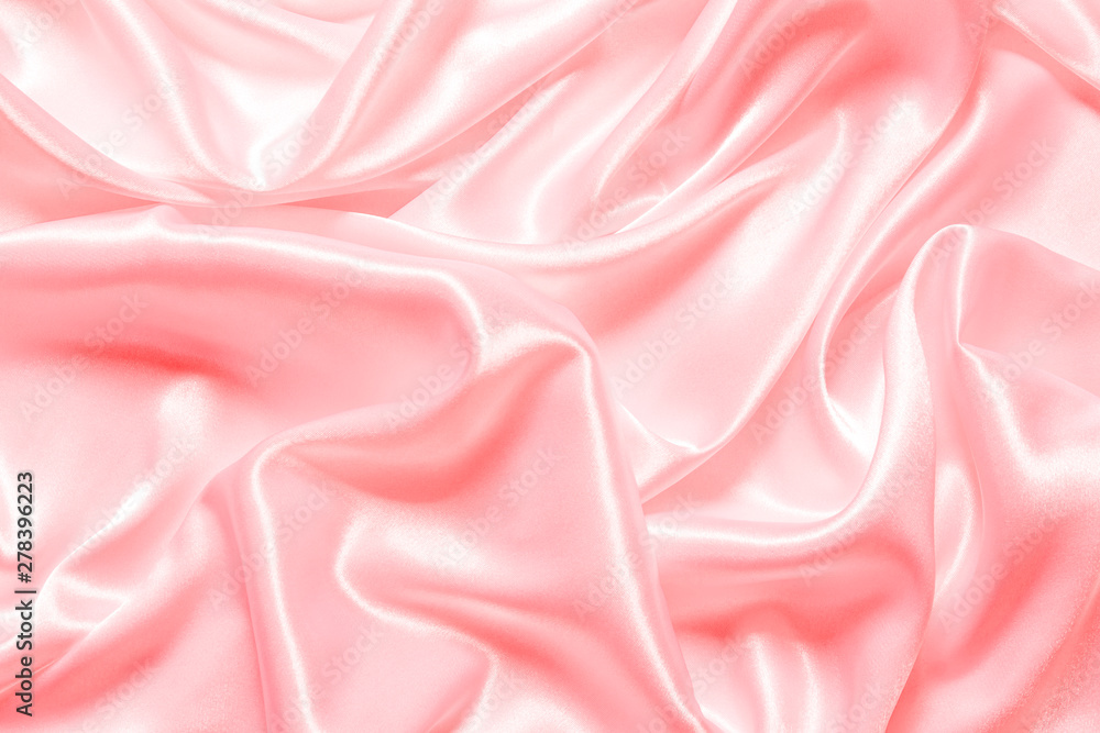 Smooth elegant pink silk or satin texture can use as background ...