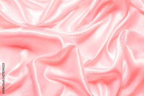 Smooth elegant pink silk or satin texture can use as background.