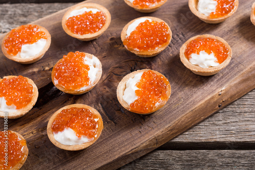 Tartalets with red caviar